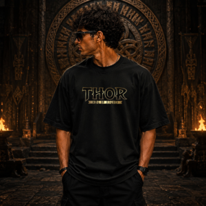Home Black oversized t-shirt featuring a Thor-inspired front logo and a bold Mjolnir hammer graphic with golden lightning artwork on the back.